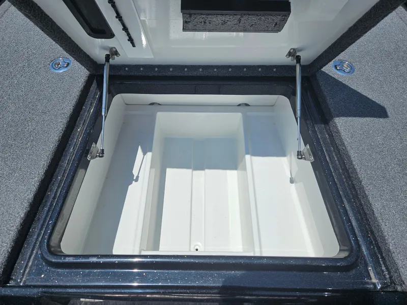 Slide: The Image of Open storage compartment of 2023 Phoenix 721 ProXP boat, showcasing spacious interior. - 9