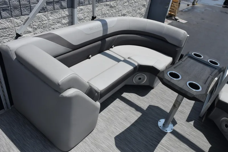 Slide: The Image of Luxurious seating on 2022 Bennington SX 23 Stern Lounge with cupholders and modern design. - 10