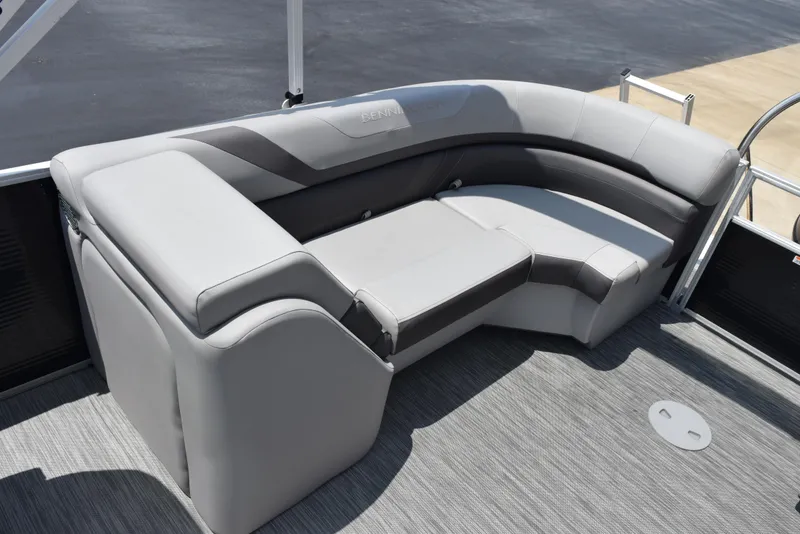 Slide: The Image of 2022 Bennington SX 23 Stern Lounge with gray cushioned seating on a boat deck. - 12