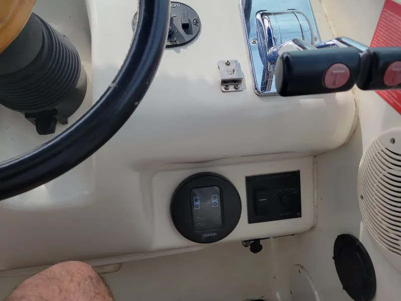 Slide: The Image of 1995 Sea Ray 370 Sundancer helm controls and dashboard details. - 10