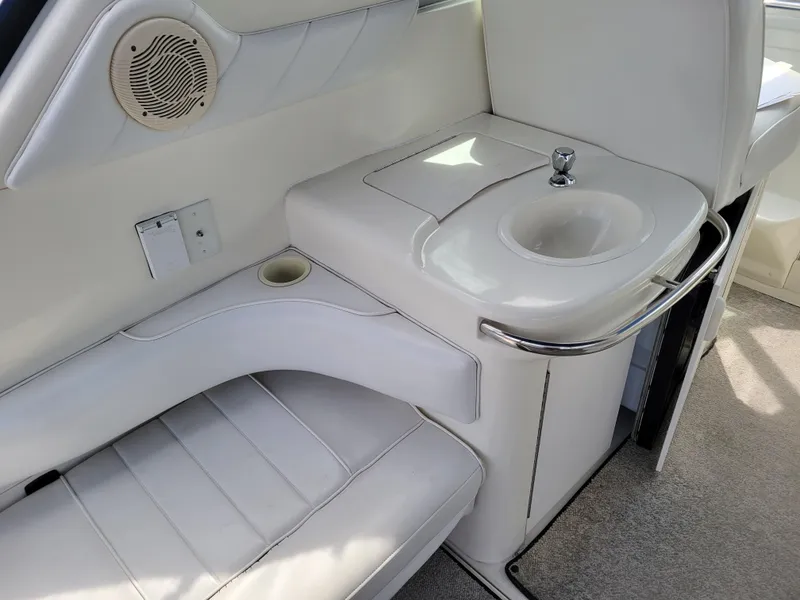 Slide: The Image of Interior of 1995 Sea Ray 370 Sundancer with sink and seating area. - 12