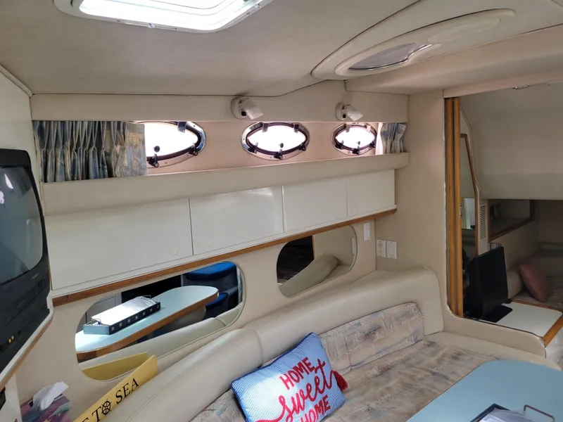 Slide: The Image of Interior of 1995 Sea Ray 370 Sundancer yacht with cozy seating and nautical decor. - 26