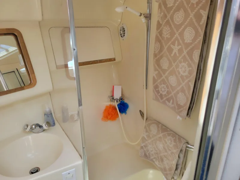 Slide: The Image of Bathroom interior of 1995 Sea Ray 370 Sundancer yacht with shower and sink. - 29
