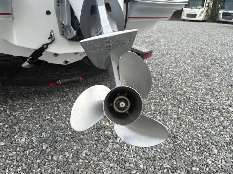 Slide: The Image of 2020 Tahoe 2150 boat propeller on gravel surface. - 12