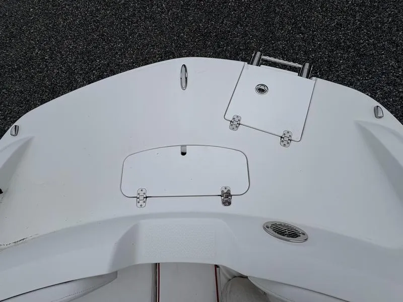 Slide: The Image of 2020 Tahoe 2150 boat deck with storage compartments and sleek design. - 7