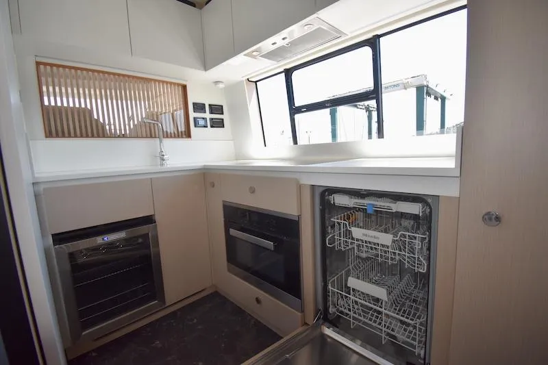 Slide: The Image of Modern kitchen in 2024 Azimut Fly 68 yacht with dishwasher and oven. - 10