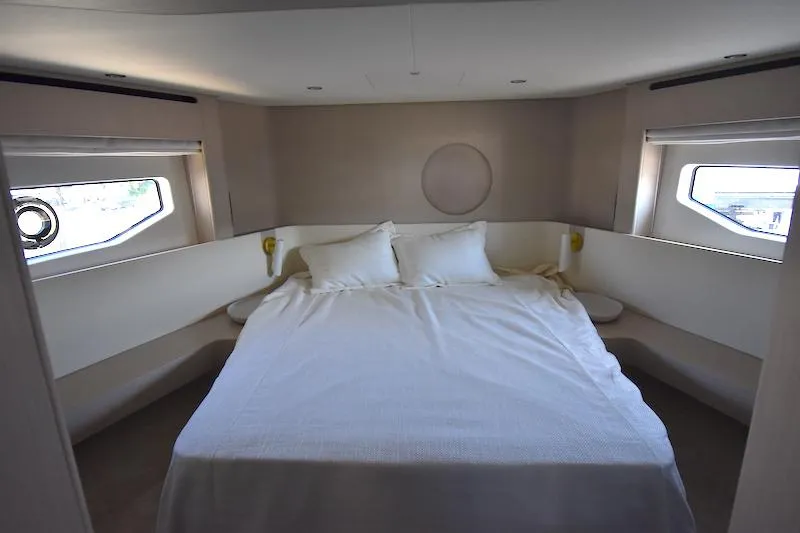Slide: The Image of Luxurious bedroom interior of 2024 Azimut Fly 68 yacht with large bed and windows. - 12
