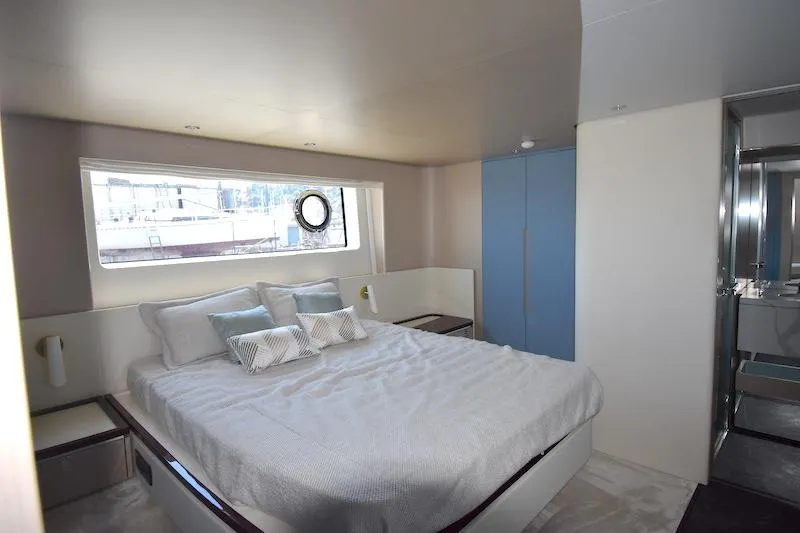 Slide: The Image of Luxurious bedroom interior of 2024 Azimut Fly 68 yacht with modern design and large window. - 15