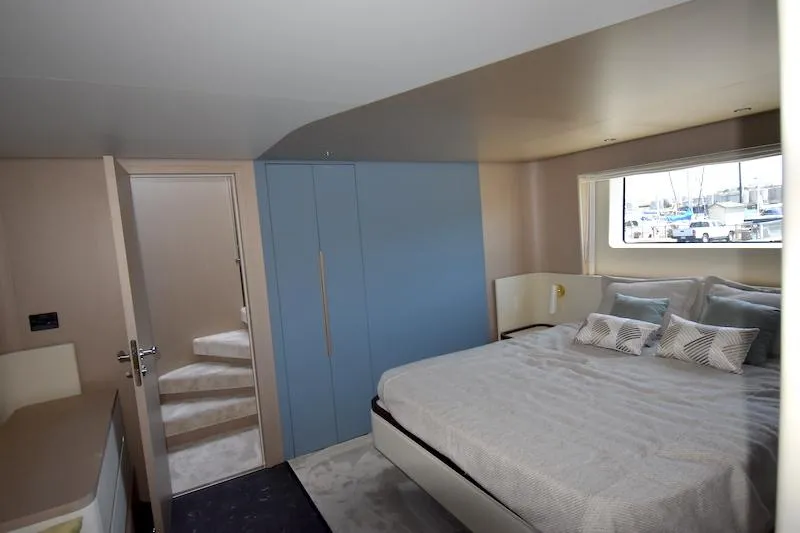 Slide: The Image of Luxurious bedroom interior of 2024 Azimut Fly 68 yacht with modern design and large window. - 19