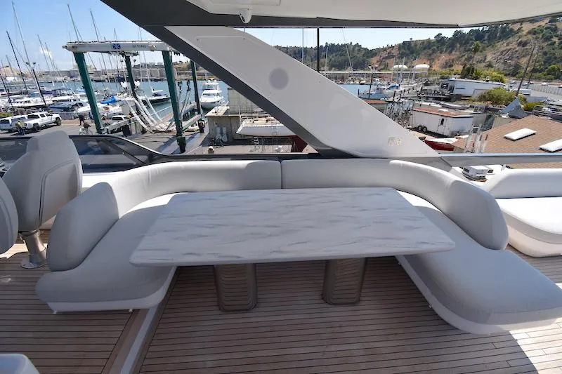 Slide: The Image of Luxurious seating area on 2024 Azimut Fly 68 yacht, featuring elegant design and marina view. - 22