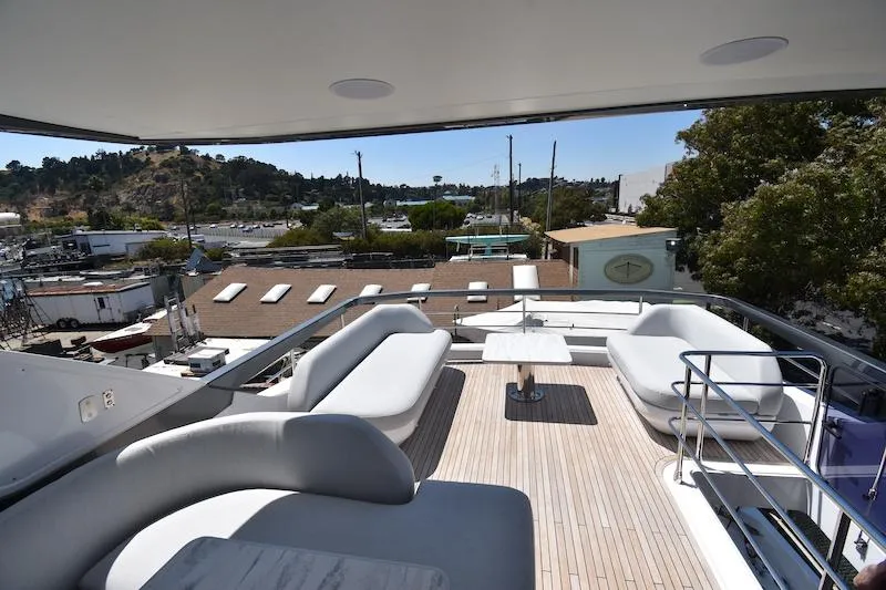 Slide: The Image of Luxurious 2024 Azimut Fly 68 yacht deck with elegant seating and scenic marina view. - 23