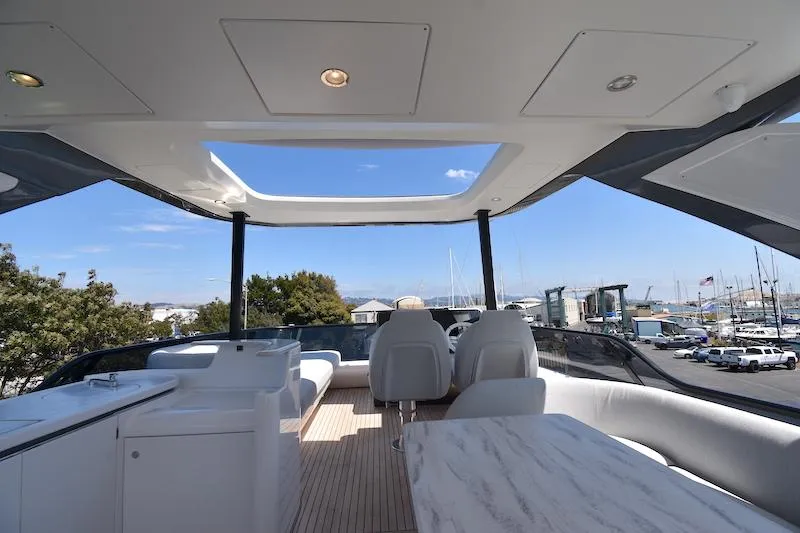 Slide: The Image of Luxurious 2024 Azimut Fly 68 yacht interior with open sky view and elegant seating. - 25