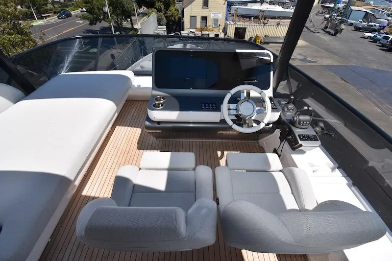 Slide: The Image of 2024 Azimut Fly 68 yacht helm with modern controls and luxurious seating. - 28