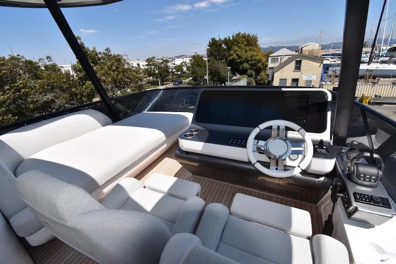 Slide: The Image of Luxurious helm of 2024 Azimut Fly 68 yacht with modern controls and seating. - 29