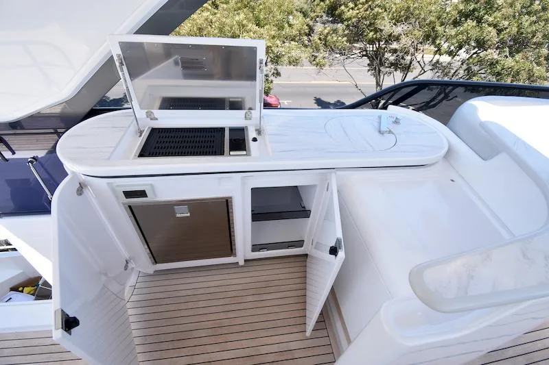 Slide: The Image of Outdoor kitchen on 2024 Azimut Fly 68 yacht with grill and storage cabinets. - 30