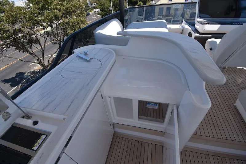 Slide: The Image of 2024 Azimut Fly 68 yacht deck with sleek white seating and modern design. - 31