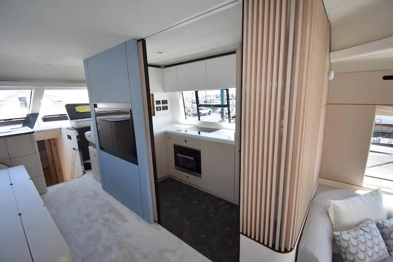 Slide: The Image of Luxurious interior of 2024 Azimut Fly 68 yacht featuring modern kitchen and stylish design. - 8