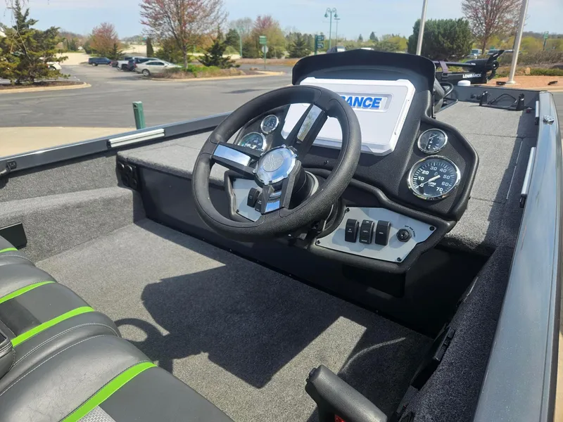 Slide: The Image of 2023 Ranger RT188 boat cockpit with steering wheel and dashboard controls. - 2