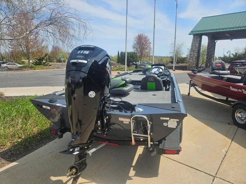 Slide: The Image of 2023 Ranger RT188 boat with outboard motor, parked outdoors on a sunny day. - 3