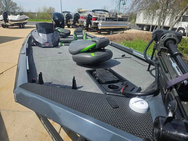 Slide: The Image of 2023 Ranger RT188 fishing boat with modern seating and equipment, parked outdoors. - 4