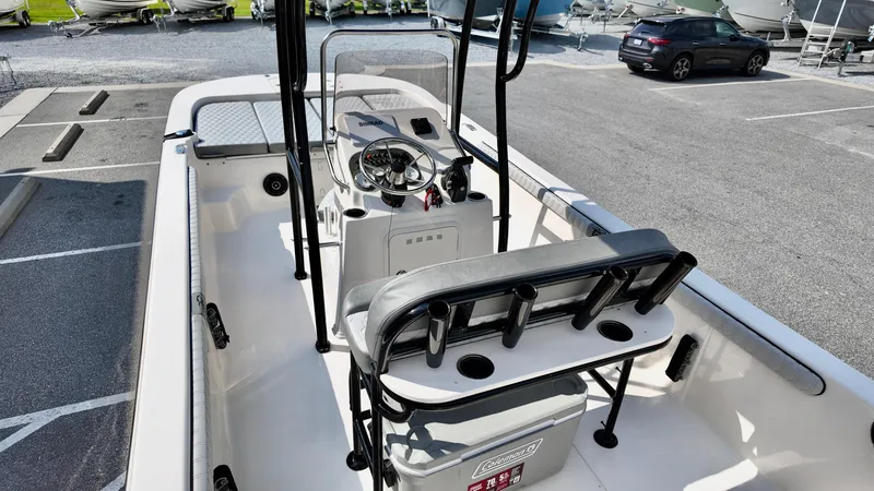 Slide: The Image of 2025 Carolina Skiff 21 LS Stealth Edition boat interior with seating and steering console. - 15