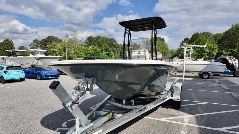 Slide: The Image of 2025 Carolina Skiff 21 LS Stealth Edition boat on trailer in parking lot. - 16