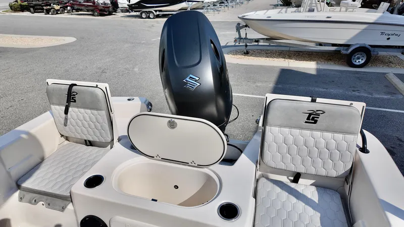 Slide: The Image of 2025 Carolina Skiff 21 LS Stealth Edition boat interior with seating and motor. - 6