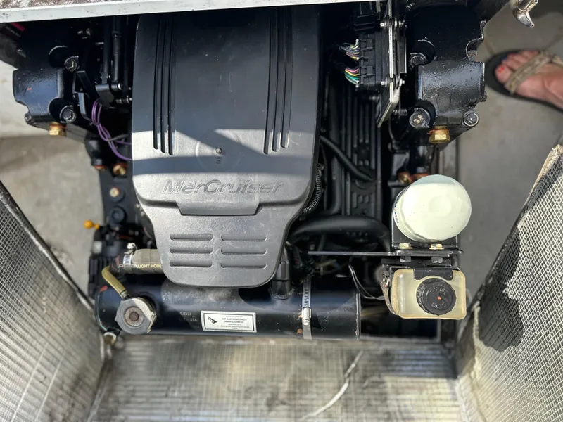 Slide: The Image of Engine of 2002 ACB 23/26 Explorer boat, featuring MerCruiser components. - 11
