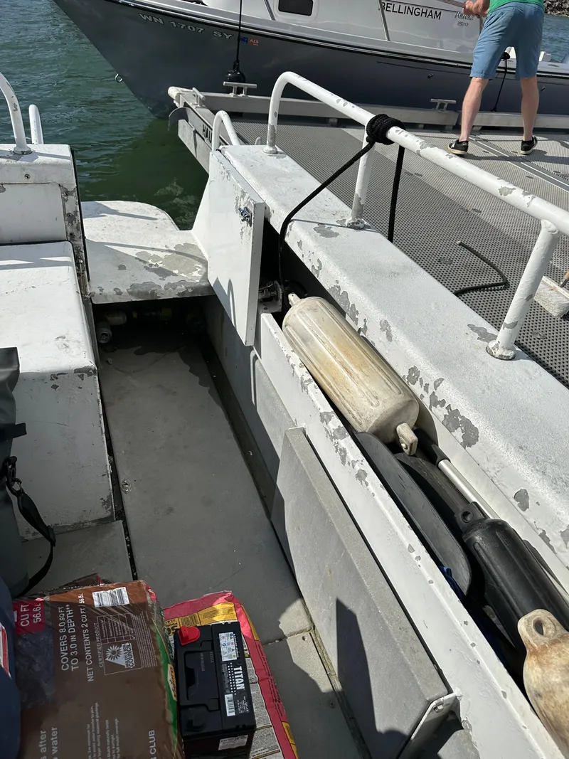 Slide: The Image of 2002 ACB 23/26 Explorer boat interior with equipment and supplies on deck. - 8