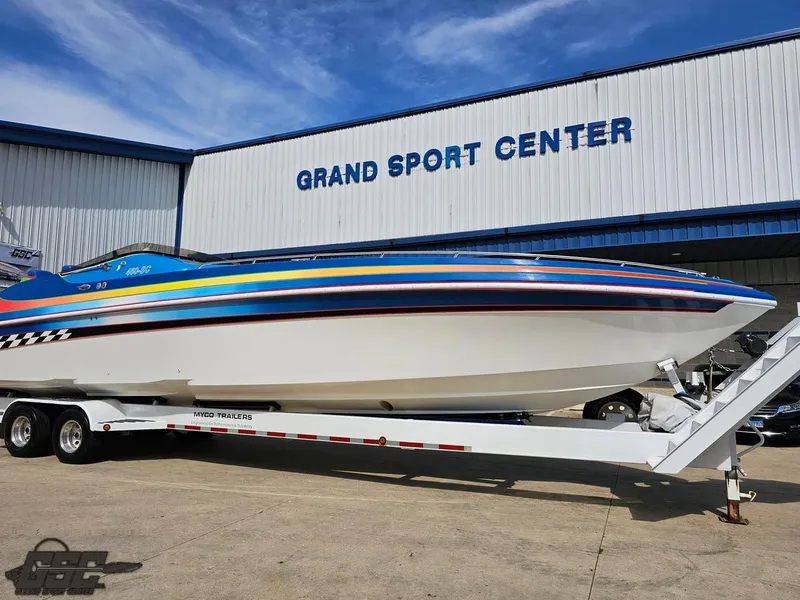 Slide: The Image of 2002 Black Thunder 460 SC boat on trailer at Grand Sport Center. - 10