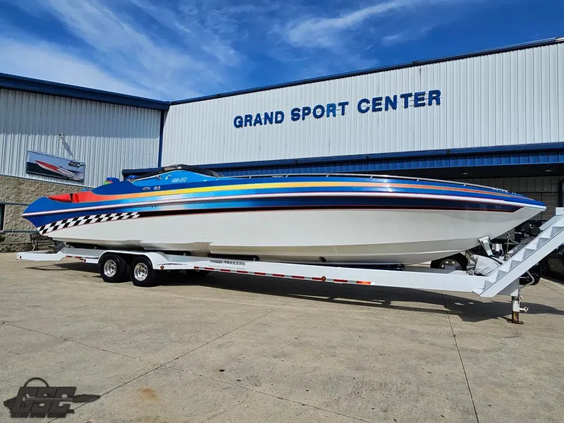 Slide: The Image of 2002 Black Thunder 460 SC boat on trailer at Grand Sport Center. - 11