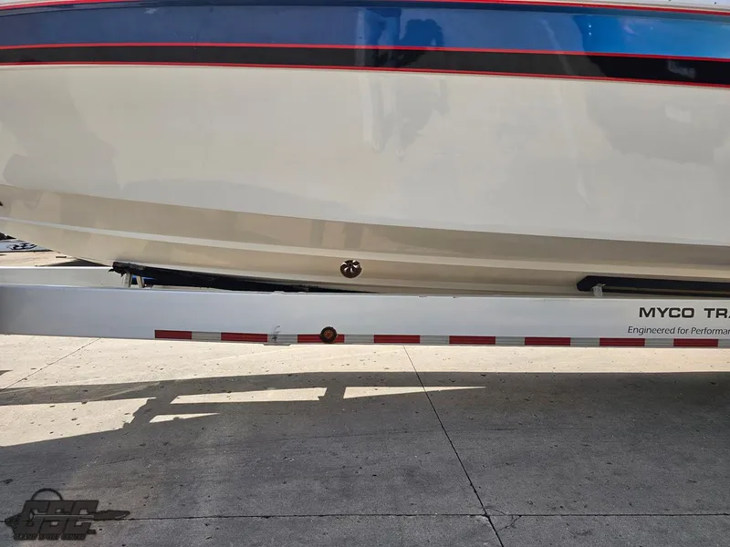 Slide: The Image of 2002 Black Thunder 460 SC boat on a Myco trailer, side view. - 16