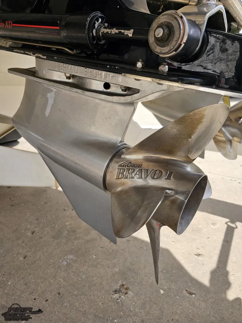 Slide: The Image of Close-up of a 2002 Black Thunder 460 SC boat propeller, featuring a Mercury Bravo I drive. - 29