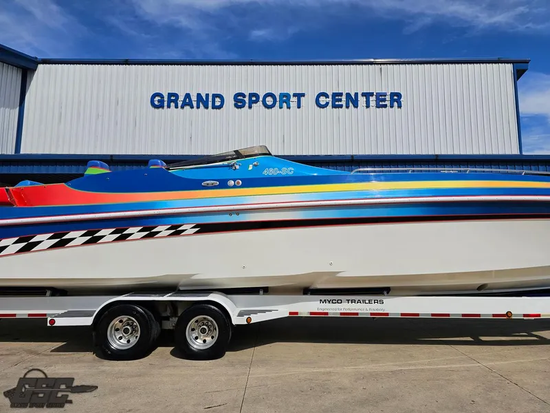 Slide: The Image of 2002 Black Thunder 460 SC boat on trailer at Grand Sport Center. - 3