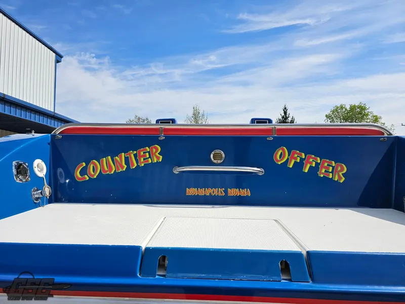 Slide: The Image of 2002 Black Thunder 460 SC boat with "Counter Offer" text, blue and white design. - 37
