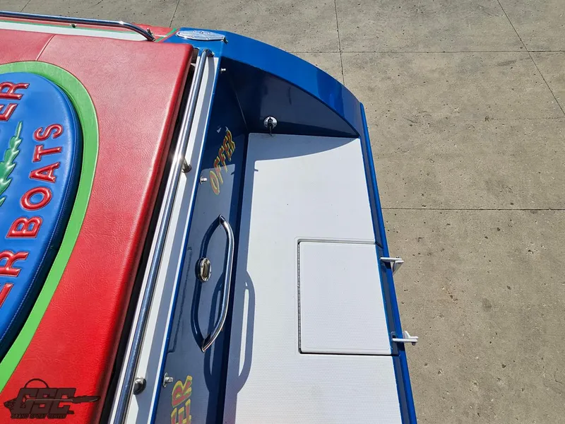 Slide: The Image of 2002 Black Thunder 460 SC boat deck with vibrant red and blue accents. - 39