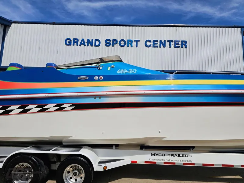 Slide: The Image of 2002 Black Thunder 460 SC boat on trailer at Grand Sport Center. - 4