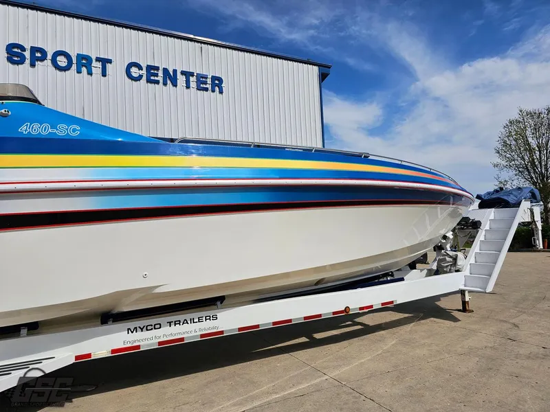Slide: The Image of 2002 Black Thunder 460 SC boat on trailer at sport center. - 5
