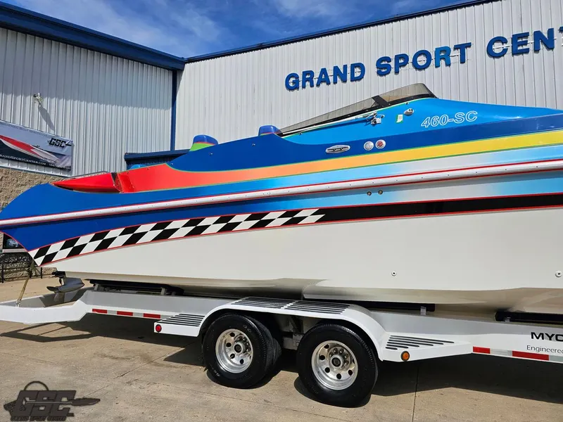 Slide: The Image of 2002 Black Thunder 460 SC boat on trailer at Grand Sport Center. - 6