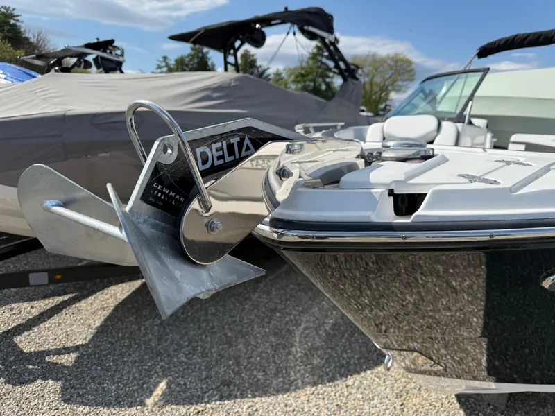 Slide: The Image of 2023 Monterey 258 Super Sport boat with Delta anchor, parked outdoors. - 12
