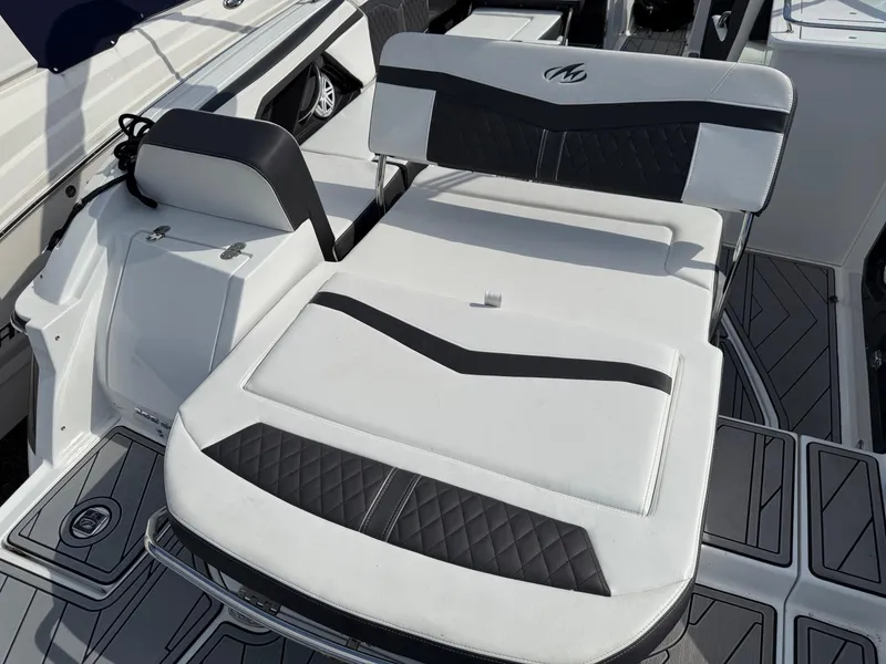 Slide: The Image of 2023 Monterey 258 Super Sport boat interior with stylish black and white seating. - 15
