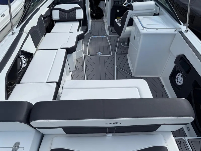 Slide: The Image of 2023 Monterey 258 Super Sport boat interior with sleek seating and modern design. - 16