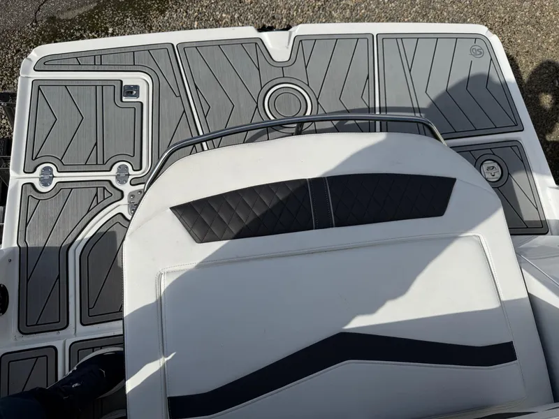 Slide: The Image of 2023 Monterey 258 Super Sport boat deck with sleek, modern design and cushioned seating. - 17