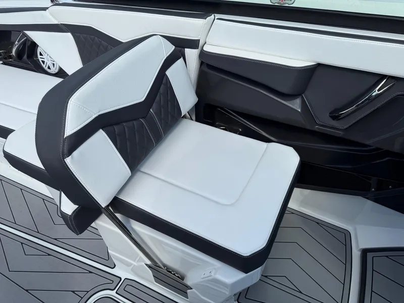 Slide: The Image of 2023 Monterey 258 Super Sport boat interior with sleek, modern seating design. - 9