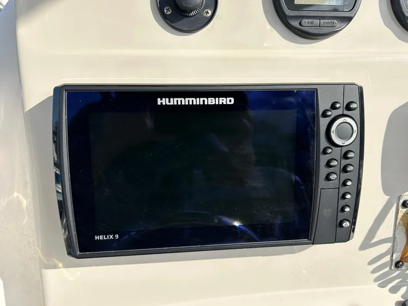 Slide: The Image of Humminbird Helix 9 fishfinder on 2011 Pioneer 222 Sportfish boat dashboard. - 11