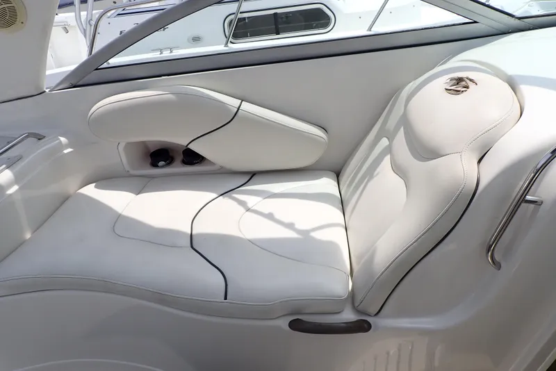 Slide: The Image of 2005 Monterey 270 Cruiser interior seating with white upholstery and sleek design. - 21