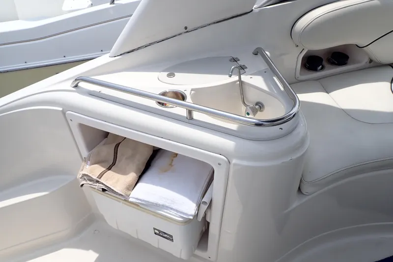 Slide: The Image of 2005 Monterey 270 Cruiser boat interior with sink and storage area. - 25