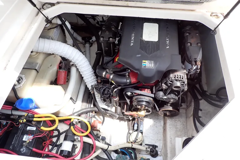 Slide: The Image of Engine compartment of a 2005 Monterey 270 Cruiser boat, featuring various mechanical components. - 48