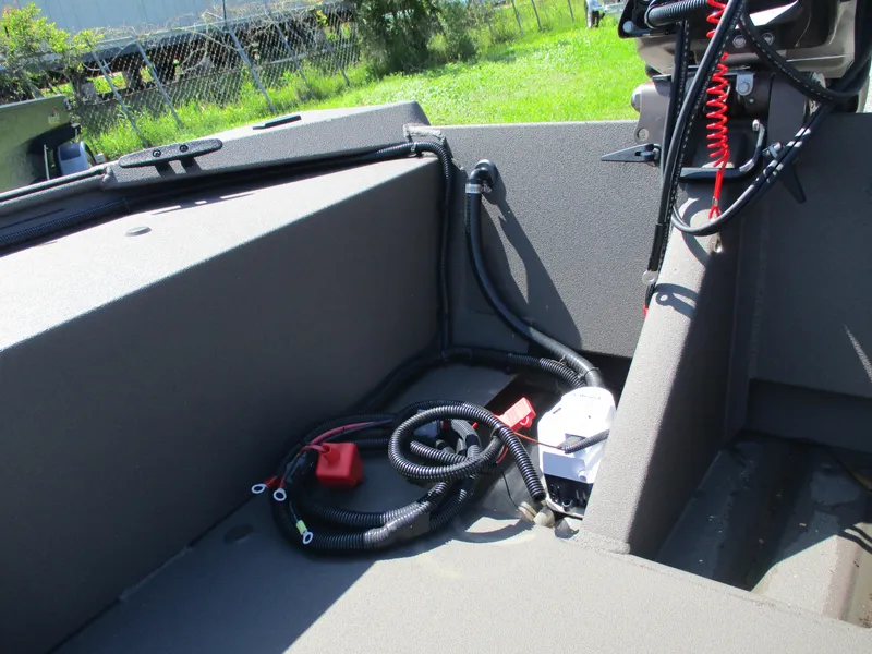 Slide: The Image of 2025 Alweld 1548 Marsh boat interior with wiring and controls, featuring a clean, organized layout. - 10