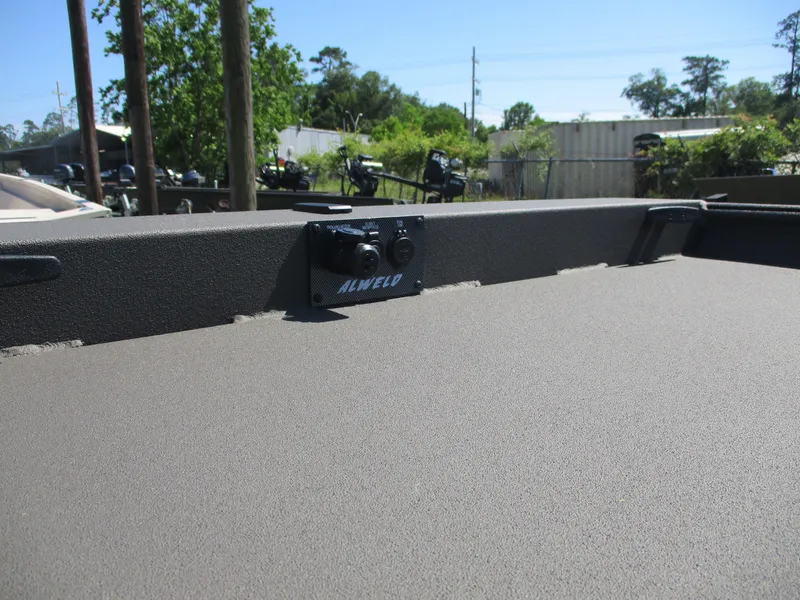 Slide: The Image of 2025 Alweld 1548 Marsh boat interior with textured surface and Alweld branding. - 11